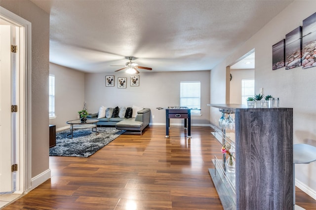 living room with wood finished floors and baseboards