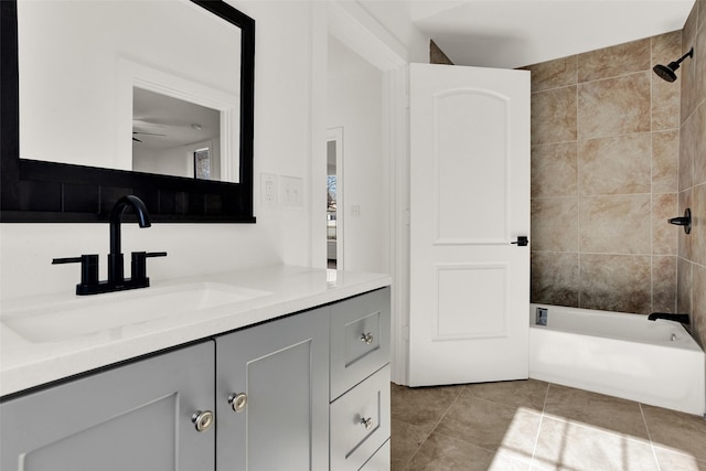 full bathroom featuring tile patterned flooring, bathtub / shower combination, and vanity