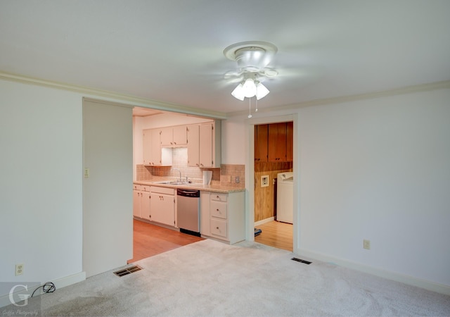 kitchen with visible vents, decorative backsplash, dishwasher, washer / clothes dryer, and light countertops