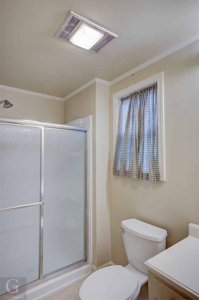 bathroom featuring a stall shower, visible vents, crown molding, and toilet