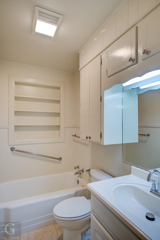 full bathroom featuring toilet, a tub, tile patterned flooring, and vanity