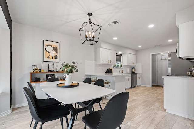 dining room with recessed lighting, visible vents, and baseboards