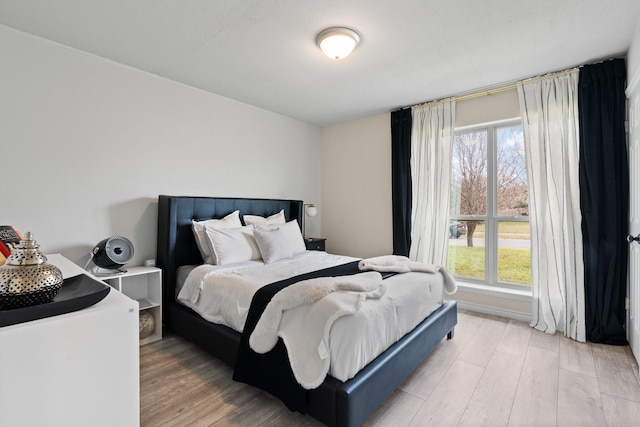 bedroom with light wood-type flooring