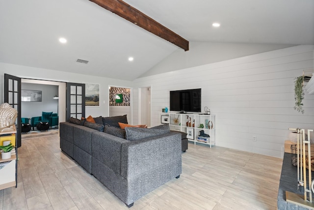 living room featuring light wood-style floors, recessed lighting, visible vents, and vaulted ceiling with beams