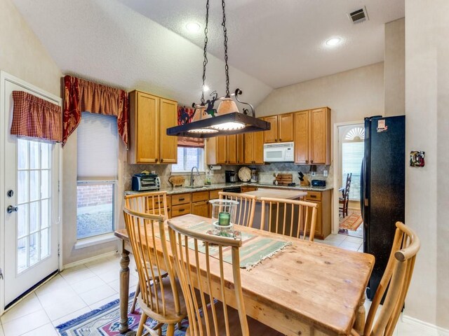 3605 Kales Ln, Flower Mound, TX 75022 - dining area with arched walkways, light tile patterned flooring, a healthy amount of sunlight, and ornamental molding