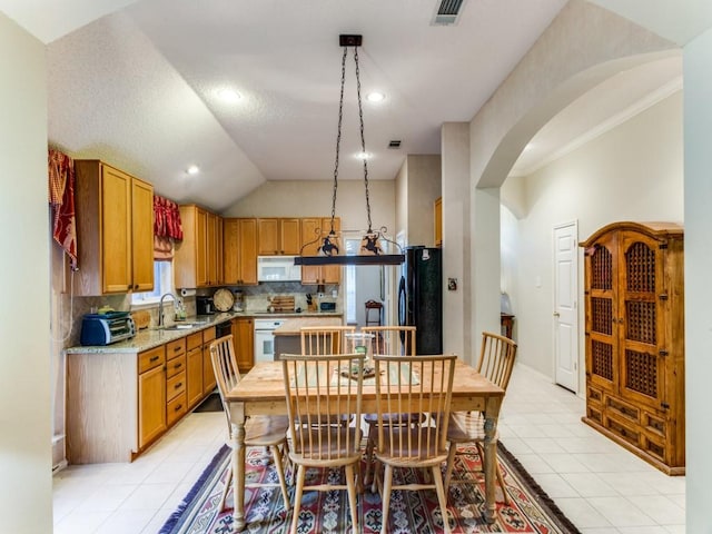 3605 Kales Ln, Flower Mound, TX 75022 - dining area featuring visible vents, arched walkways, plenty of natural light, and light tile patterned floors