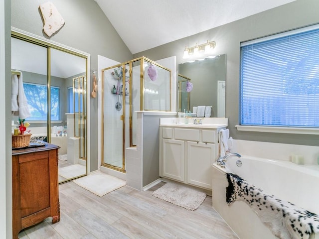 3605 Kales Ln, Flower Mound, TX 75022 - bathroom featuring two vanities, a sink, and a garden tub