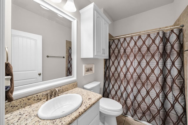 bathroom with toilet, tile patterned floors, a shower with shower curtain, and vanity