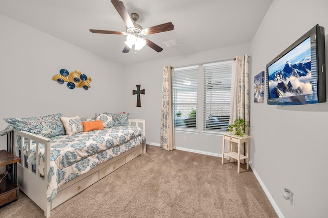 bedroom featuring carpet floors, baseboards, and a ceiling fan