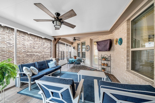 view of patio / terrace featuring ceiling fan, outdoor dining area, and an outdoor living space