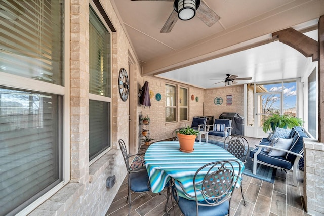 view of patio / terrace with a ceiling fan, a grill, and a porch