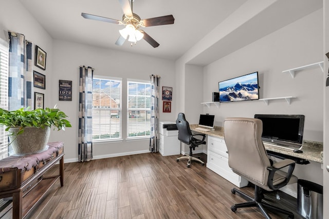 office area featuring a ceiling fan, dark wood-style flooring, and baseboards