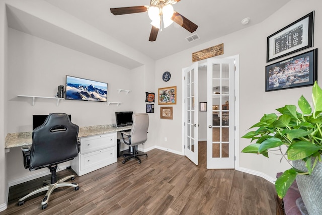 office area featuring dark wood-style flooring, a ceiling fan, visible vents, baseboards, and french doors