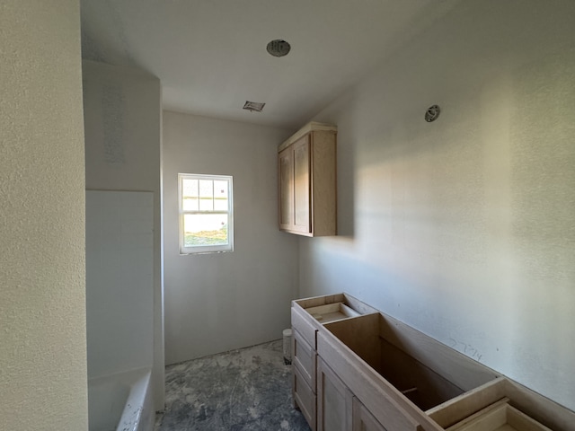 full bathroom featuring a tub and visible vents