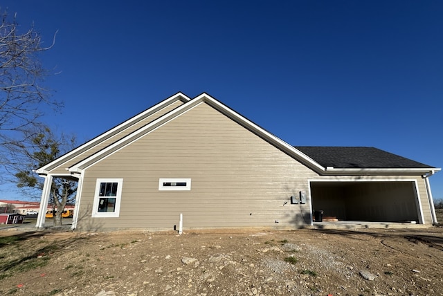 view of side of property with an attached garage