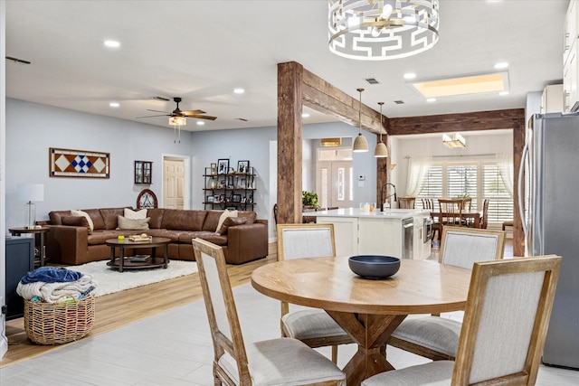 dining space with recessed lighting, visible vents, and ceiling fan with notable chandelier