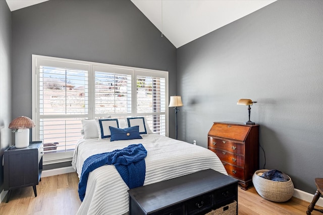 4105 Cimmaron Trl, Granbury, TX 76049 - bedroom featuring high vaulted ceiling, light wood-style flooring, and baseboards