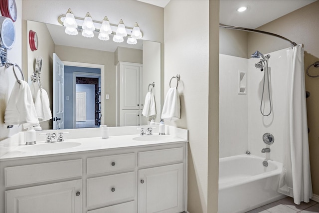 full bathroom featuring a sink, shower / bathtub combination with curtain, double vanity, and tile patterned flooring