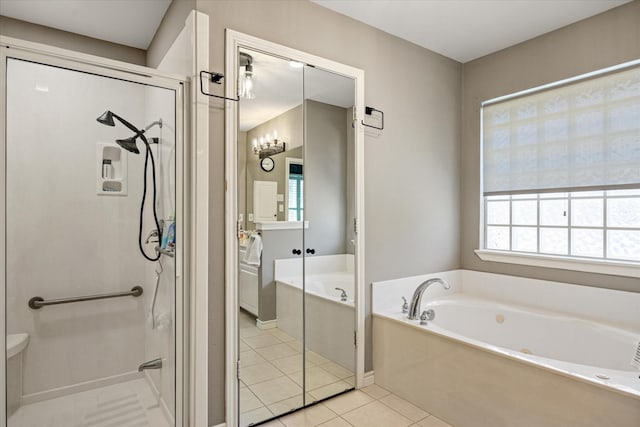 bathroom with tile patterned floors, a bath, and a stall shower