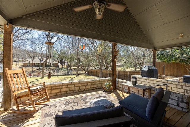 wooden terrace featuring a ceiling fan, a patio, fence, and grilling area