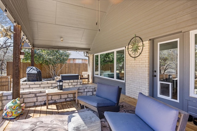 view of patio / terrace with outdoor lounge area and fence