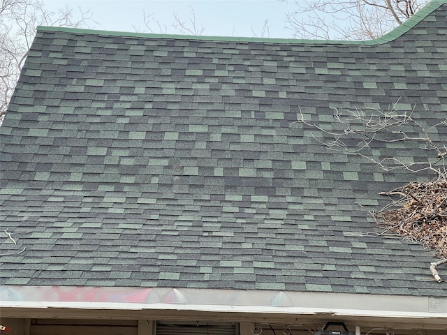 exterior details featuring a shingled roof