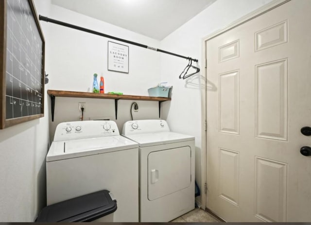 washroom featuring laundry area and washer and clothes dryer