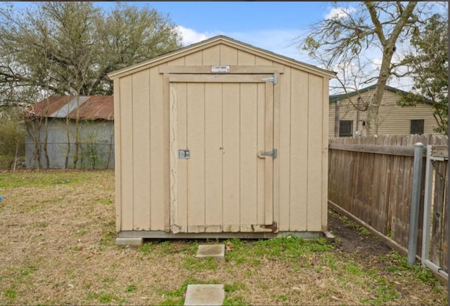 view of shed with fence