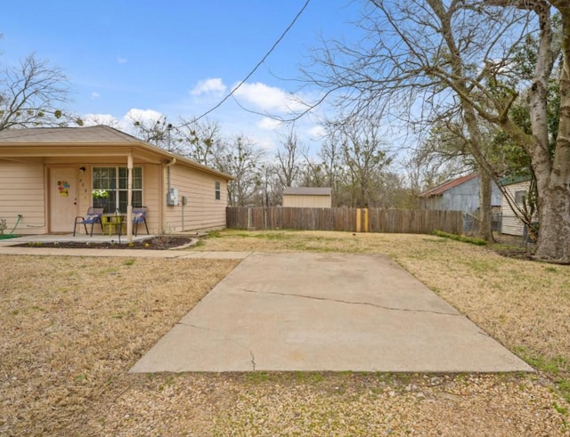 view of yard with a patio area and fence