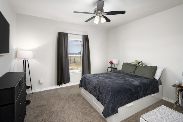 bedroom featuring a ceiling fan, carpet flooring, and baseboards