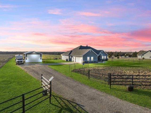 surrounding community featuring a yard, a rural view, and fence