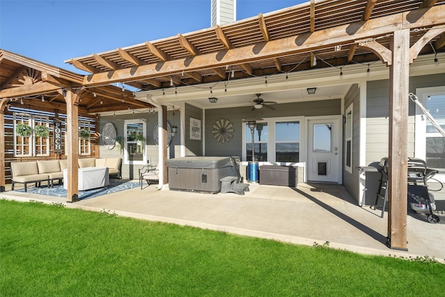 rear view of property featuring a hot tub, a patio, a chimney, an outdoor living space, and a pergola