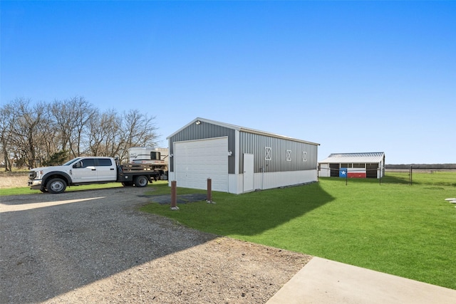 exterior space featuring an outbuilding and gravel driveway