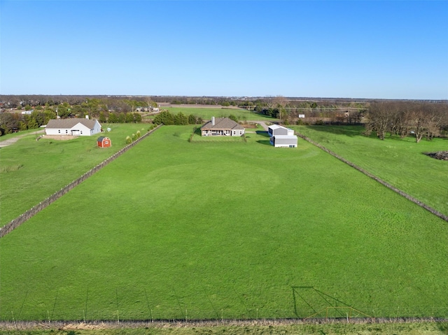 birds eye view of property with a rural view