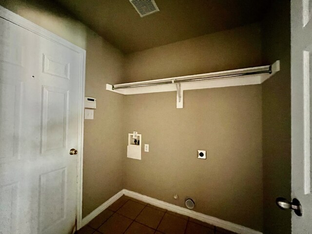 2436 Castle Pines Dr, Burleson, TX 76028 - laundry room featuring visible vents, dark tile patterned flooring, gas dryer hookup, hookup for an electric dryer, and washer hookup