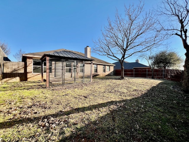 2436 Castle Pines Dr, Burleson, TX 76028 - rear view of property with brick siding, a fenced backyard, a chimney, and a gazebo