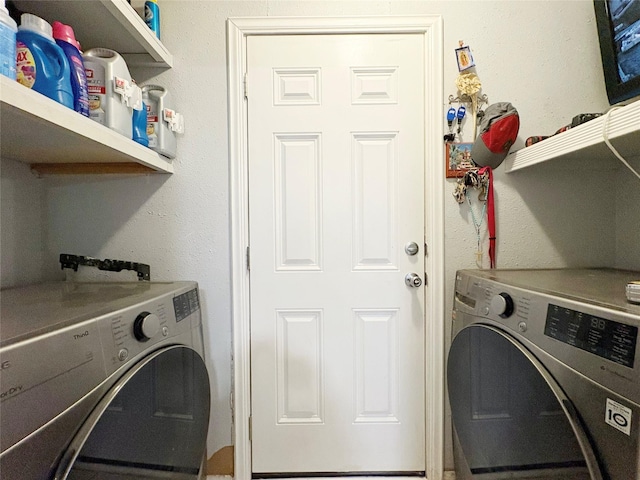 clothes washing area featuring laundry area and independent washer and dryer