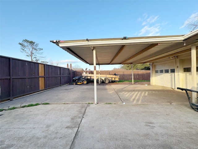 view of parking / parking lot featuring fence