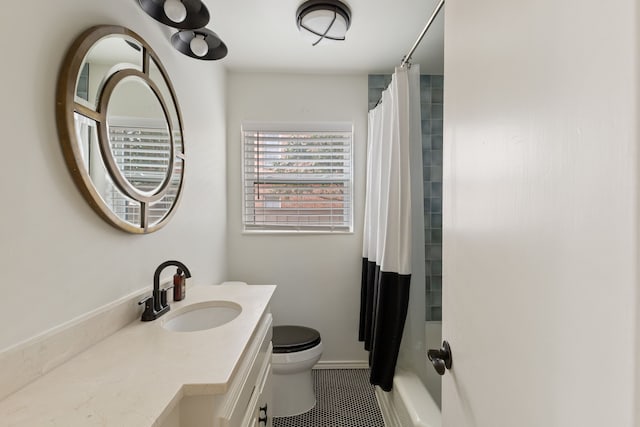 bathroom with vanity, tile patterned floors, toilet, and shower / bath combo with shower curtain