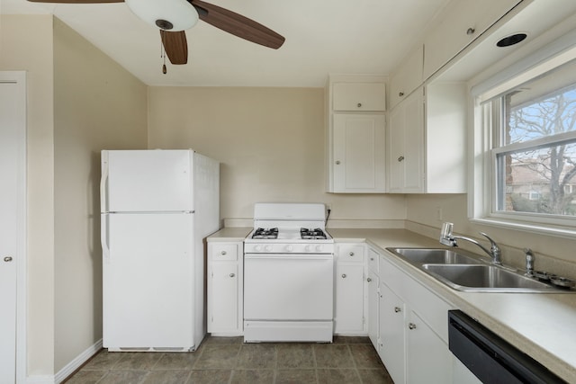 kitchen featuring white appliances, ceiling fan, a sink, light countertops, and white cabinets