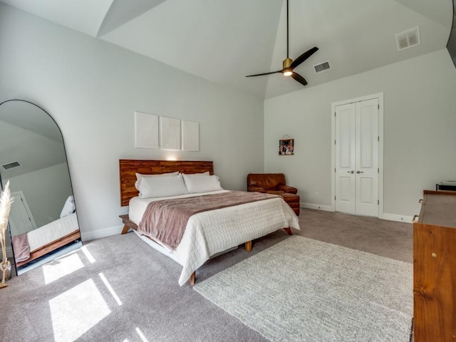 carpeted bedroom with lofted ceiling, visible vents, and baseboards