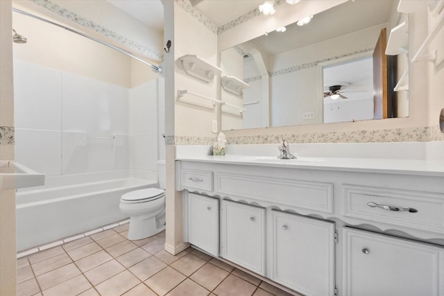 full bath with shower / bathing tub combination, toilet, ceiling fan, vanity, and tile patterned floors