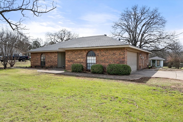 single story home with an attached garage, brick siding, driveway, roof with shingles, and a front yard