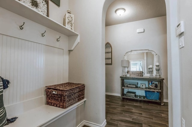 713 Falcon Rd, Argyle, TX 76226 - mudroom featuring arched walkways, wood finished floors, and baseboards