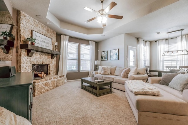 713 Falcon Rd, Argyle, TX 76226 - carpeted living area featuring a ceiling fan, a fireplace, and baseboards