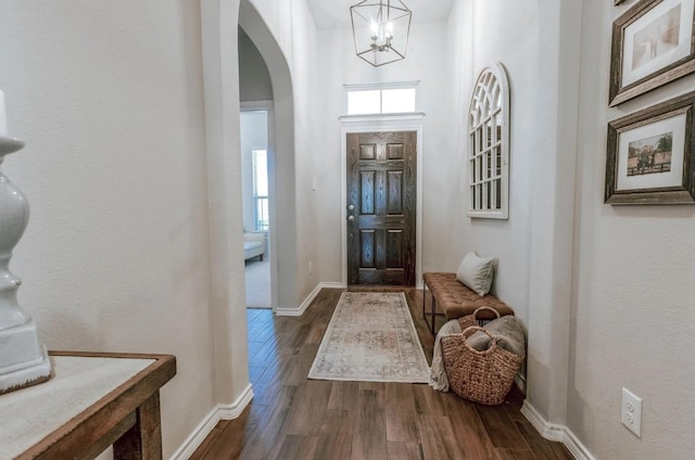 713 Falcon Rd, Argyle, TX 76226 - foyer entrance with dark wood finished floors, plenty of natural light, and arched walkways