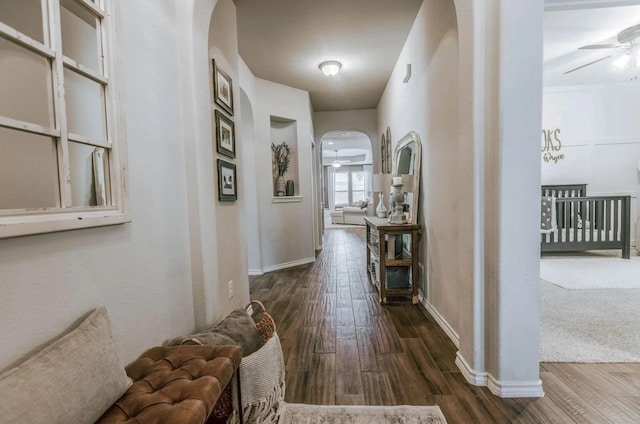 713 Falcon Rd, Argyle, TX 76226 - corridor with arched walkways, dark wood-style flooring, and baseboards