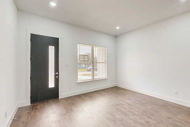 entrance foyer featuring recessed lighting, baseboards, and wood finished floors