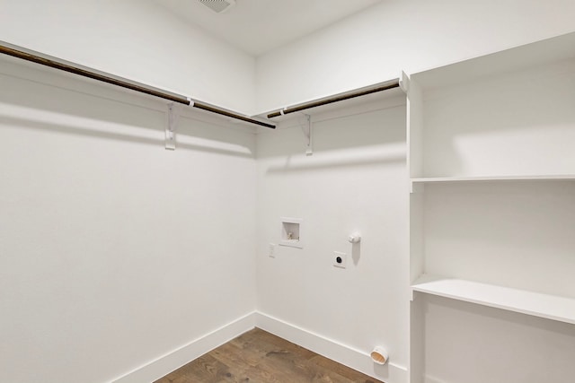 washroom with washer hookup, hookup for a gas dryer, hookup for an electric dryer, laundry area, and baseboards