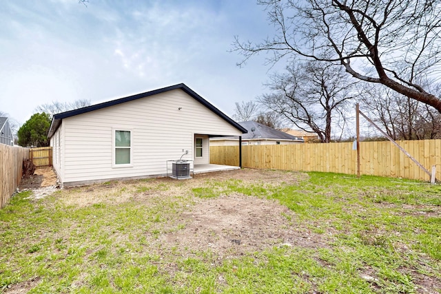 back of property featuring central AC, a patio area, and a fenced backyard